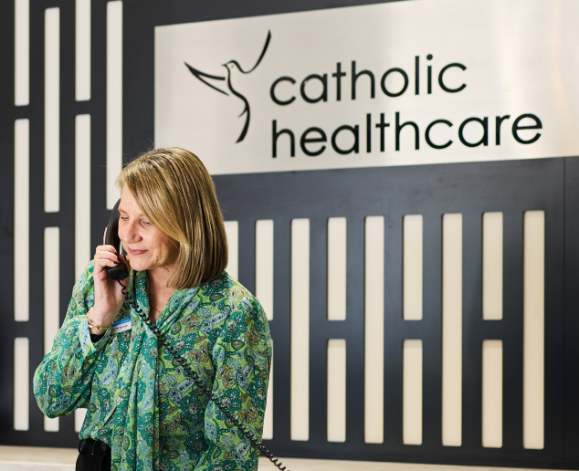 A woman answering a phone.